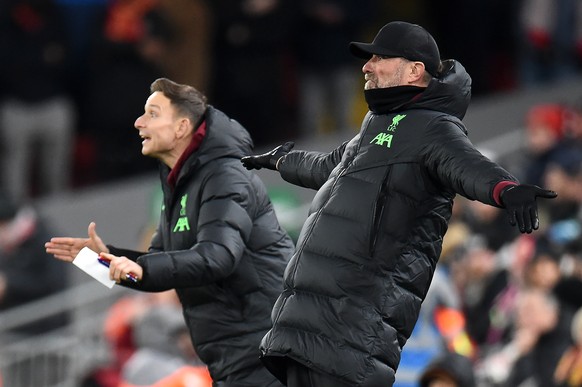 epa11004379 Liverpool manager Juergen Klopp (R) and his assistant Pepijn Lijnders gesture on the touchline during the UEFA Europa League group E match between Liverpool and LASK in Liverpool, Britain, ...