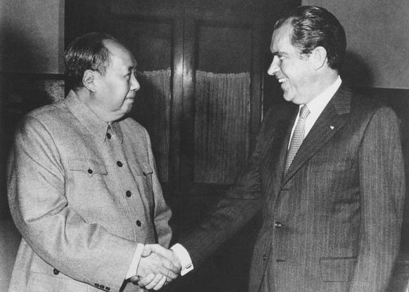 FILE - Then Chinese communist party leader Mao Zedong, left, and then U.S. President Richard Nixon shake hands as they meet in Beijing on Feb. 21, 1972. At the height of the Cold War, U.S. President R ...
