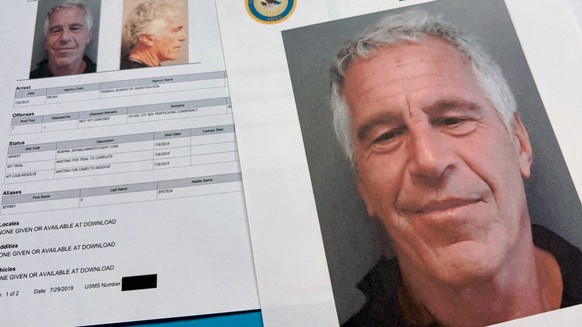 Documents that were included in the U.S. Department of Justice release of the Jeffrey Epstein files are photographed Friday, Jan. 2, 2026. (AP Photo/Jon Elswick)
Justice Department Jeffrey Epstein
