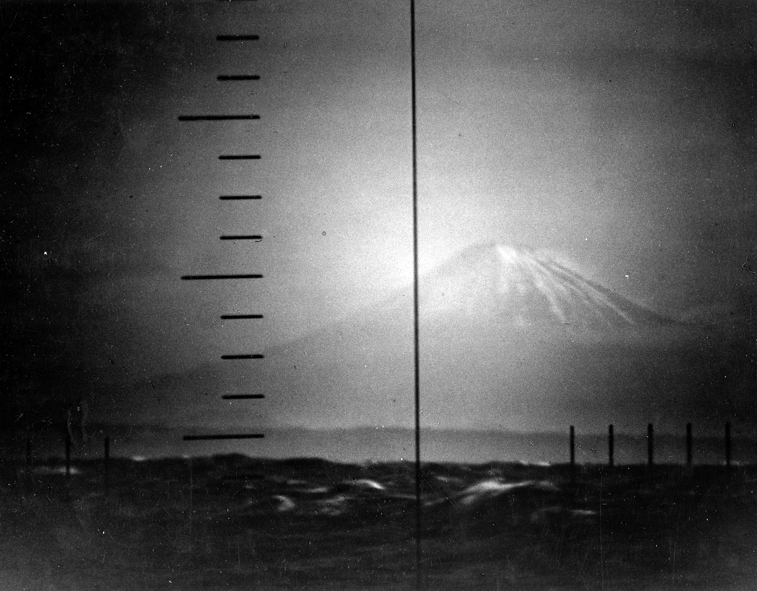 Mount Fuji photographed through the periscope of the submarine USS Trigger (SS237) during war patrol. 22 April 1943