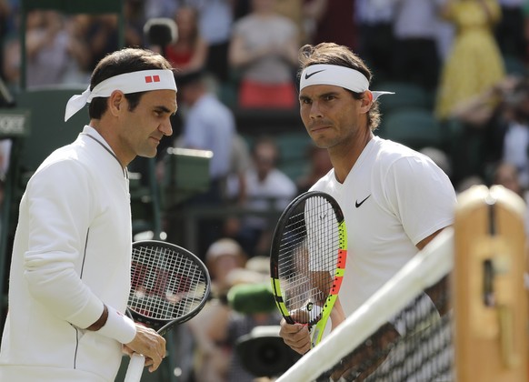 Spain&#039;s Rafael Nadal and Switzerland&#039;s Roger Federer, left, pose before a men&#039;s singles semifinal match on day eleven of the Wimbledon Tennis Championships in London, Friday, July 12, 2 ...