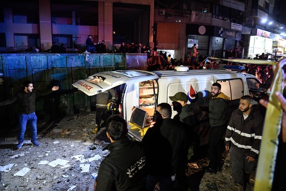 epa11054045 An ambulance arrives at the site of an explosion in the southern district of Dahiyeh, Beirut, Lebanon, 02 January 2024. According to Lebanese state media, at least six people were killed i ...