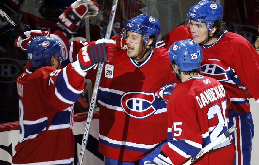 Montreal Canadiens Mark Streit, center, celebrates his goal with teammates Andrei Markov, Mathieu Dandenault and Maxim Lapierre, left to right, during second period NHL action Monday, Jan. 29, 2007 in ...