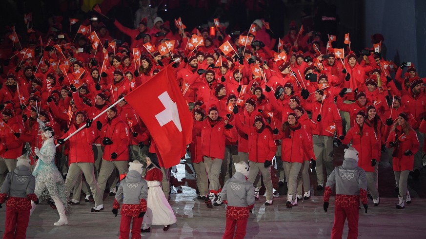 epa06508261 Team Switzerland with flag bearer Dario Cologna during the Opening Ceremony of the PyeongChang 2018 Olympic Games at the Olympic Stadium, Pyeongchang county, South Korea, 09 February 2018. ...