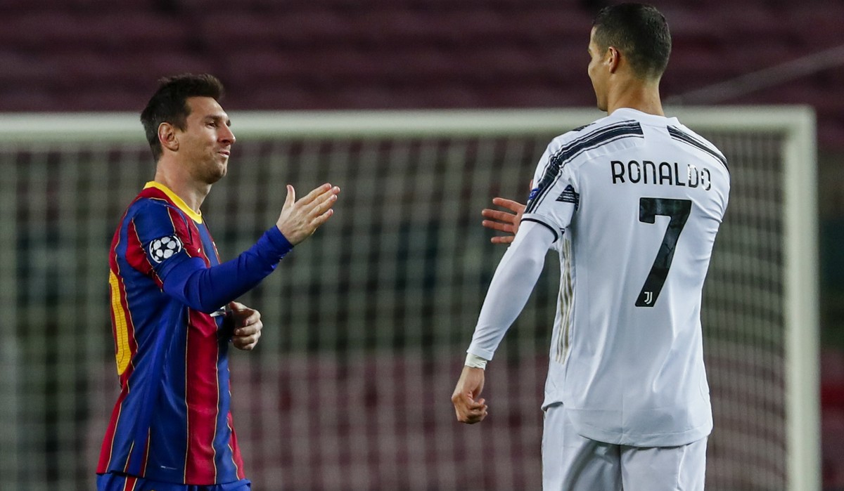 Barcelona's Lionel Messi, left, shakes has with Juventus' Cristiano Ronaldo prior of the start of the Champions League group G soccer match between FC Barcelona and Juventus at the Camp Nou  ...