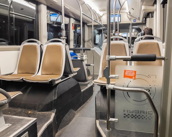 Zurich, Switzerland - February 5, 2021: The interior of an almost empty city bus in Zurich on a night ride