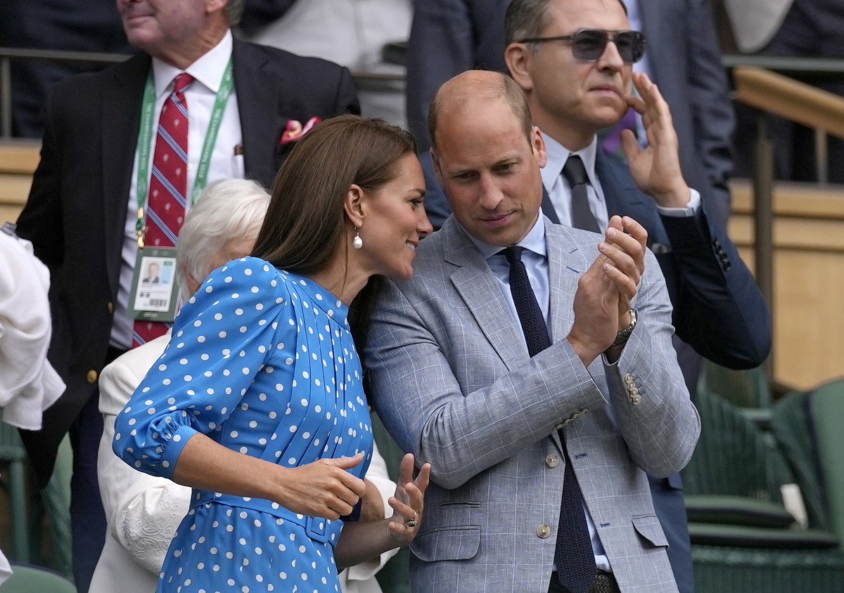 Britain's Prince William and Kate, Duchess of Cambridge applaud after watching the men's singles quarterfinal match between Serbia's Novak Djokovic and Italy's Jannik Sinner on day ...