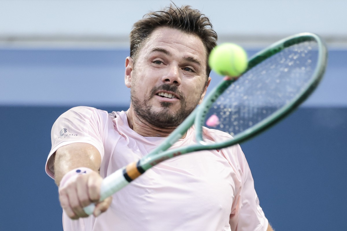 epa11567979 Stan Wawrinka of Switzerland hits a return to Mattia Bellucci of Italy (not shown) during their first round match in the US Open Tennis Championships at the USTA Billie Jean King National  ...