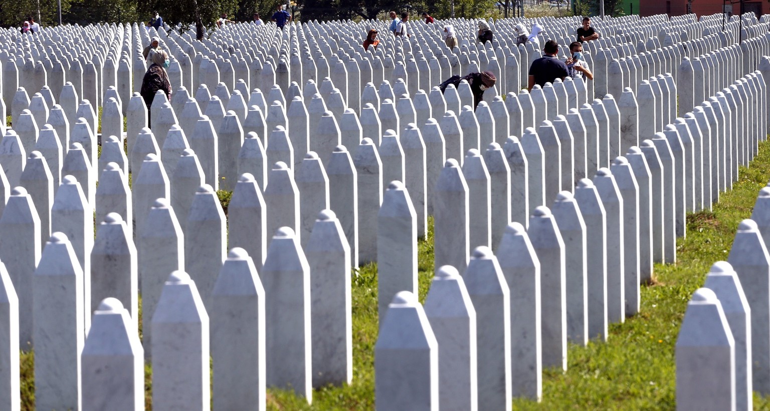 epa08540255 A general view during the funeral of 9 newly-identified Bosnian Muslims at the Potocari Memorial Center, Srebrenica, Bosnia and Herzegovina, 11 July 2020. The burial was part of a memorial ...