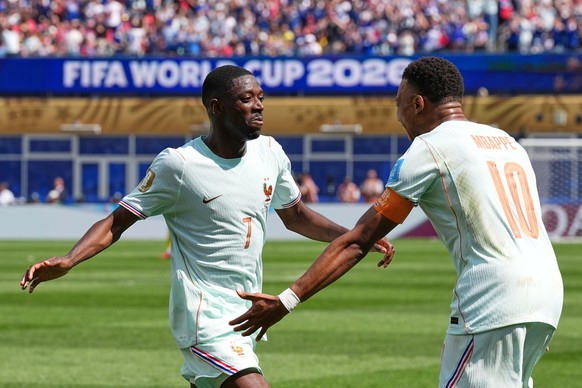 France's Ousmane Dembele celebrates with Kylian Mbappe, right, after scoring his side's third goal during the World Cup Group I soccer match between Norway and France in Foxborough, Mass., n ...