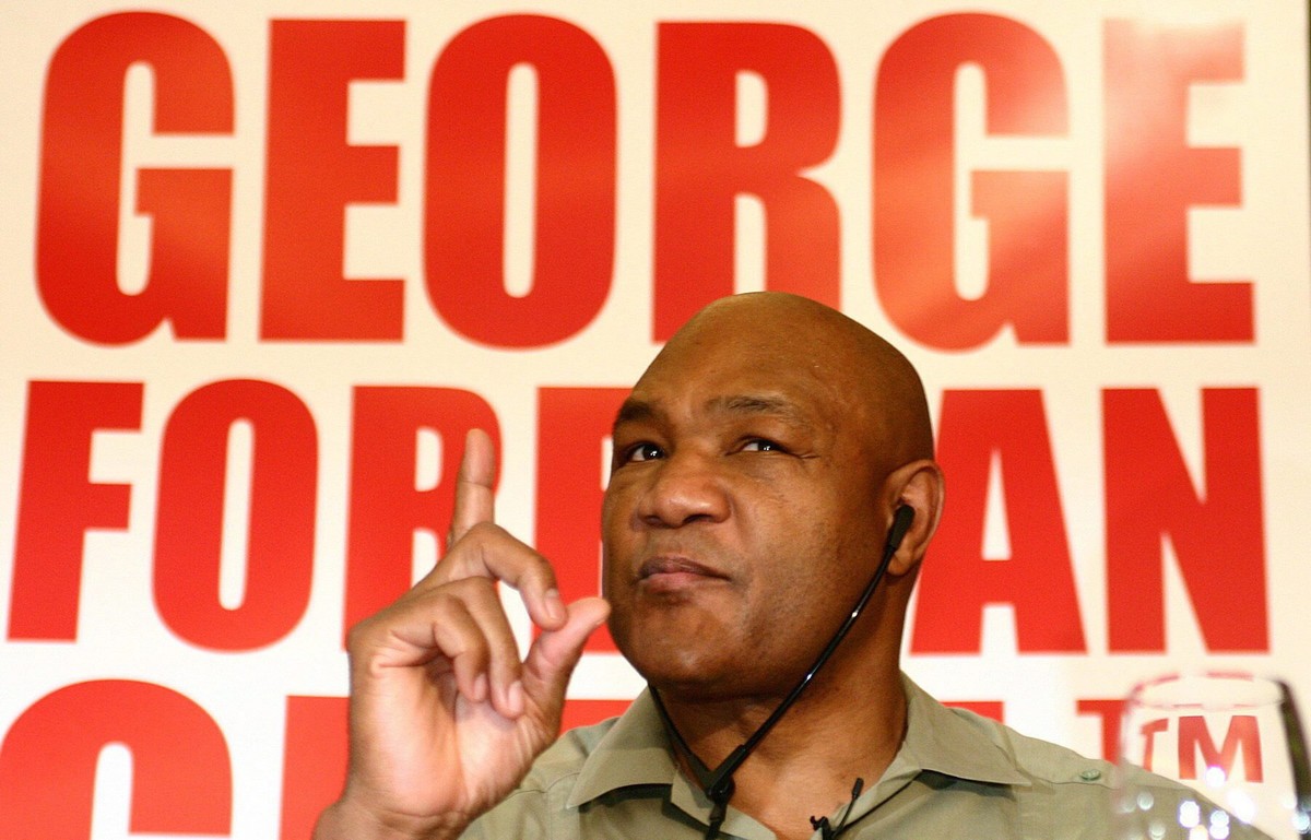 epa11980409 (FILE) - Former US boxer George Foreman gestures on Wednesday, 12 November 2003 during a press conference where he presented his grill in Sao Paulo, Brazil (re-issued 22 March 2025). Georg ...