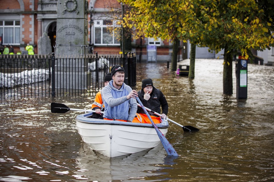 People canoe down a flooded Bank Parade in Newry Town, Co Down, Northern Ireland, Tuesday, Oct. 31, 2023. Flooding was reported in parts of Northern Ireland, with police cautioning people against trav ...