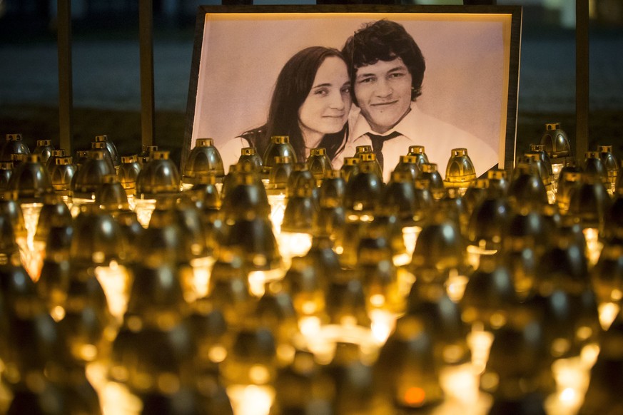 FILE- In this picture taken on Wednesday, Feb. 28, 2018, candles are placed during a silent protest in memory of murdered journalist Jan Kuciak and his girlfriend Martina Kusnirova in Bratislava, Slov ...