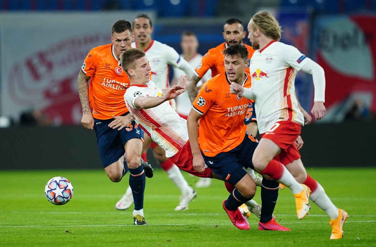 epa08760060 Leipzig's Dani Olmo (2-L) is being fouled during the UEFA Champions League group stage soccer match between RB Leipzig and Istanbul Basaksehir in Leipzig, Germany, 20 October 2020. EP ...