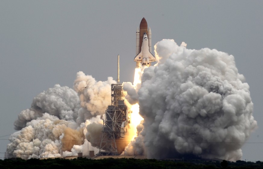 FILE - In this Friday, July 8, 2011 file photo, space shuttle Atlantis lifts off from Pad 39A at the Kennedy Space Center in Cape Canaveral, Fla. The STS135 mission, the final shuttle flight, brought  ...