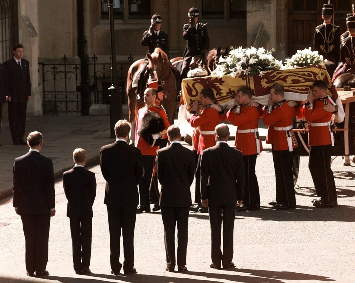 FILE - In this Sept. 6, 1997 file photo, the coffin of Diana, Princess of Wales, is carried into London's Westminster Cathedral, watched by, from left, Diana's former husband Prince Charles, ...