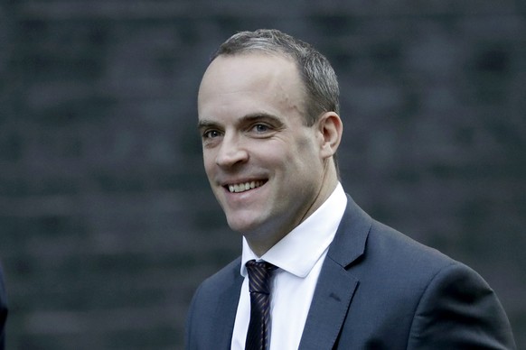 FILE - In this Tuesday, Nov. 13, 2018 file photo, Britain&#039;s Secretary of State for Exiting the European Union Dominic Raab arrives for a cabinet meeting at 10 Downing Street in London. Prime Mini ...