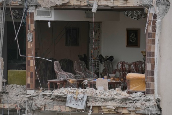 Rubble covers a damaged living room with its walls blown out in a residential building hit in an earlier U.S.-Israeli strike in Tehran, Iran, Monday, March 23, 2026. (AP Photo/Vahid Salemi)
Iran US Is ...
