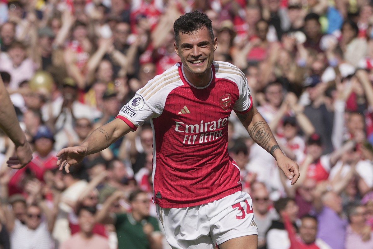 Arsenal's Granit Xhaka celebrates after scoring his side's opening goal during the English Premier League soccer match between Arsenal and Wolverhampton Wanderers at the Emirates Stadium in  ...