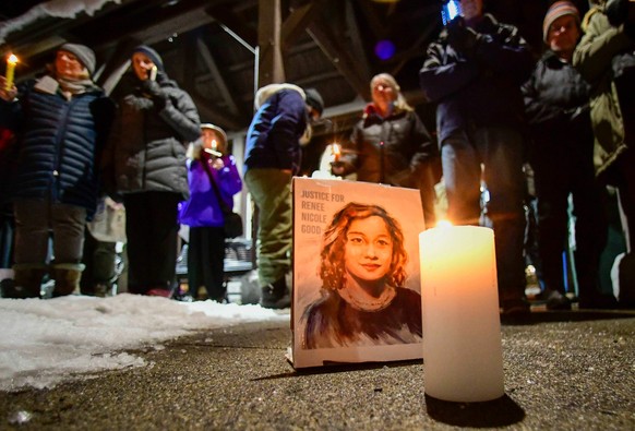 A picture of Renee Good, who was shot and killed U.S. Immigration and Customs Enforcement in Minneapolis on Wednesday is displayed during a candlelight vigil in Pliny Park in Brattleboro, Vt., on Thur ...