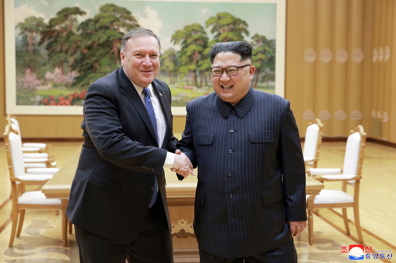 FILE - In this May 9, 2018, file photo provided by the North Korean government, U.S. Secretary of State Mike Pompeo, left, shakes hands with North Korean leader Kim Jong Un during a meeting at Workers ...