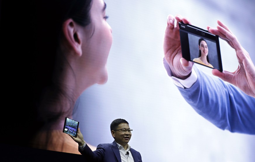 Huawei CEO Richard Yu displays the new Huawei Mate X foldable 5G smartphone at the Mobile World Congress, in Barcelona, Spain, Sunday, Feb. 24, 2019. The fair started with press conferences on Sunday, ...