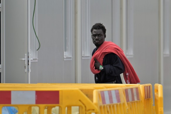 epa12467764 A migrant looks on at La Restinga port after arriving on board a small boat in El Hierro Island, Canary Islands, Spain, 20 October 2025. Some ten migrants from Senegal, including four mino ...