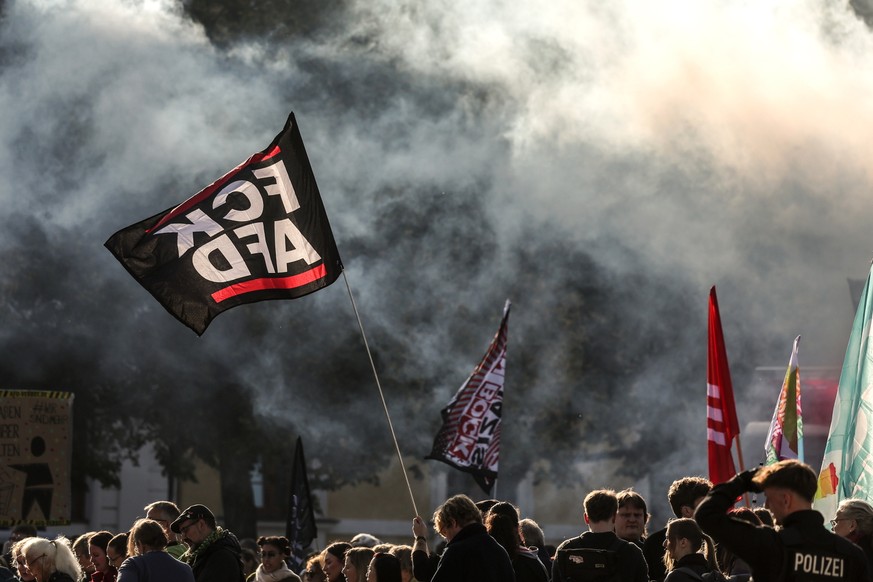 KEYPIX - epa13284268 Demonstrators hold banners and flags during a protest against the far-right Alternative for Germany (AfD) party ahead of the constitutive session of Saxony-Anhalt's new state ...