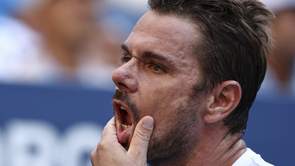 Stan Wawrinka, of Switzerland, reacts during a match against Jannik Sinner, of Italy, during the third round of the U.S. Open tennis championships, Saturday, Sept. 2, 2023, in New York. (AP Photo/Andr ...