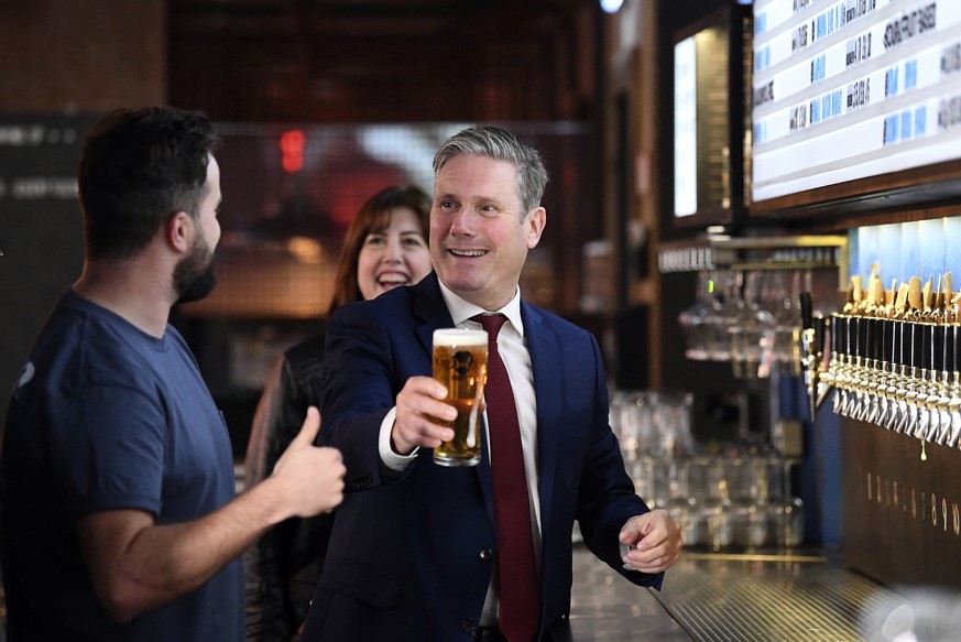 Britain&#039;s Labour Party leader Keir Starmer, right, and shadow Business and Consumer Affairs Minister, Lucy Powell visit the Brewdog Pub and Brewery in the City of London, Monday July 6, 2020, whe ...