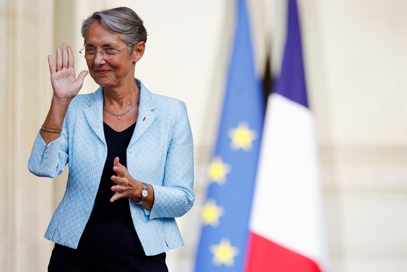 epa09951613 Newly-appointed French Prime Minister Elisabeth Borne gestures as she attends a handover ceremony in the courtyard of Hotel Matignon in Paris, France, 16 May 2022. Elisabeth Borne is the s ...