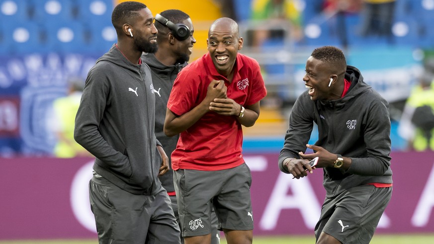 Switzerland&#039;s soccer players Johan Djourou, goalkeeper Yvon Landry Mvogo, Gelson Fernandes, and Denis Zakaria, from left to right, react before during the FIFA soccer World Cup 2018 group E match ...