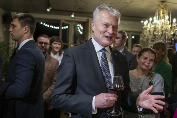 Lithuania&#039;s President Gitanas Nauseda, a presidential candidate, celebrates winning the first round of Lithuania&#039;s presidential election, in Vilnius, Lithuania, late Sunday, May 12, 2024. (A ...