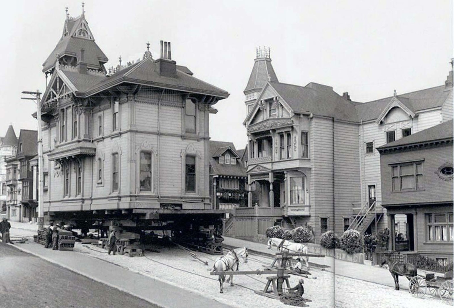 Moving a house using horses. San Franciso, 1908.