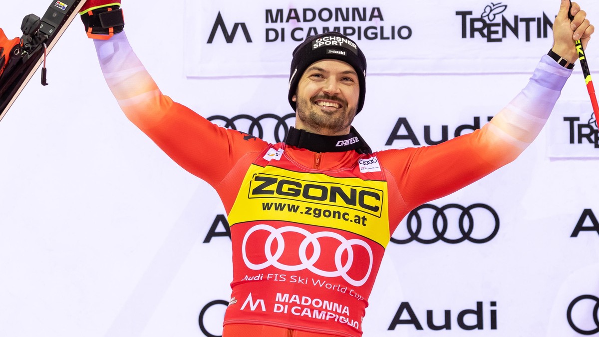 epa11813775 Second placed Loic Meillard of Switzerland celebrates on the podium after the Men's Slalom race of the Alpine Skiing World Cup in Madonna di Campiglio, Italy, 08 January 2025. EPA/AND ...