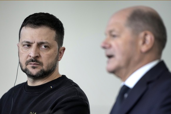 German Chancellor Olaf Scholz (right) and Ukrainian President Volodymyr Zelenskyy attend a press conference at the Chancellery in Berlin, Friday, February 16, 2024. (AP Photo/Markus Schreiber)
