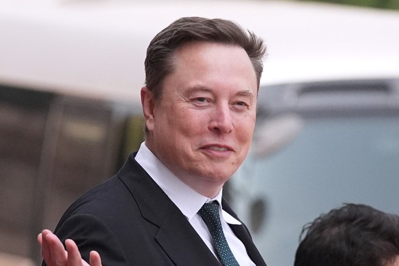 FILE - Elon Musk departs after a welcome ceremony with President Donald Trump and China's President Xi Jinping at the Great Hall of the People, Thursday, May 14, 2026, in Beijing. (AP Photo/Mark  ...