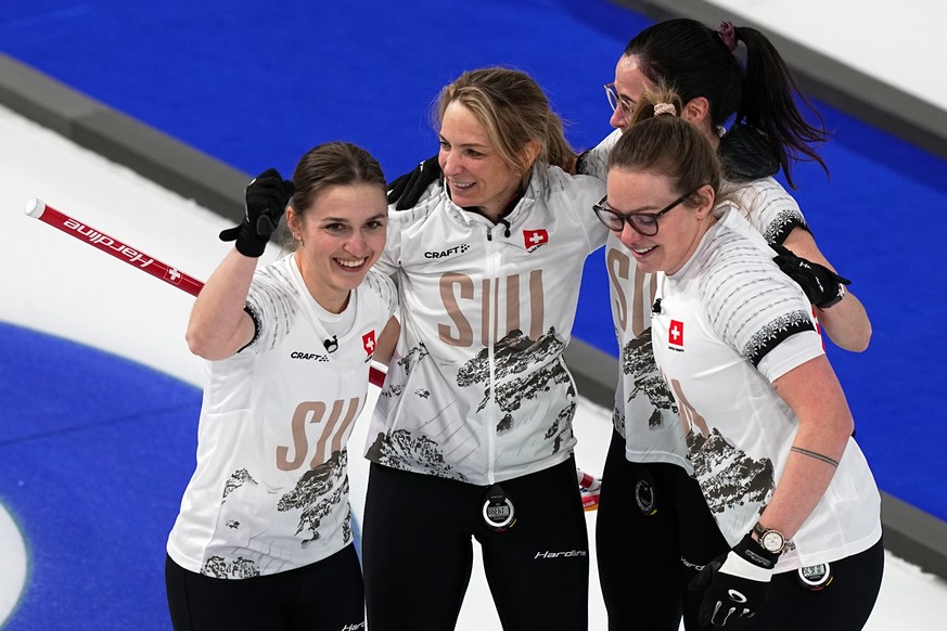 Switzerland's Silvana Tirinzoni, Alina Paetz, Selina Witschonke, Carole Howald celebrate winning a women's curling semifinal match against the United States, at the 2026 Winter Olympics, in  ...