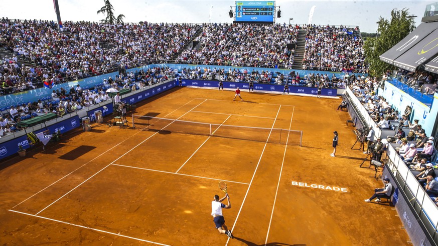 epaselect epa08483101 Viktor Troicki (front) of Serbia plays a backhand against Novak Djokovic of Serbia during their match for the Adria Tour tennis tournament in Belgrade, Serbia, 13 June 2020. The  ...