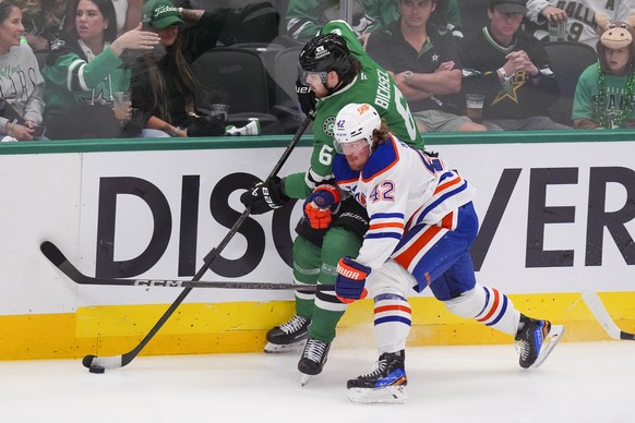 Dallas Stars defenseman Lian Bichsel (6) and Edmonton Oilers right wing Kasperi Kapanen (42) compete for the puck during the third period in Game 2 of the Western Conference finals in the NHL hockey S ...