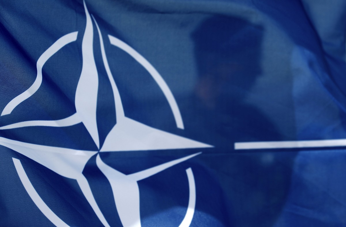 epa12141041 A NATO flag is seen during Media Day at the 'Latvian Shield 25' exercise at the Riga Hydroelectric Power Plant in Dole, Latvia, 28 May 2025. The exercise strengthens cooperation  ...