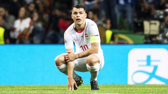 epa07628563 Swiss players (L-R) Manuel Akanji, Edimilson Fernandes, and Granit Xhaka react during the UEFA Nations League semi final soccer match between Portugal and Switzerland at the Dragao stadium ...