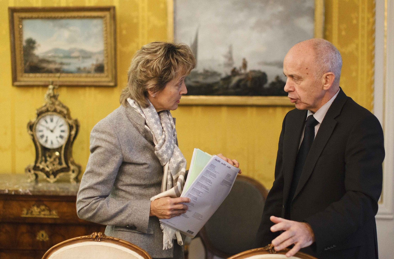 Swiss Finance Minister Eveline Widmer-Schlumpf (L) speaks to Swiss Defence Minister Ueli Maurer before the traditional von Wattenwyl talks in Bern, Switzerland in this November 18, 2011 file photo. Wi ...