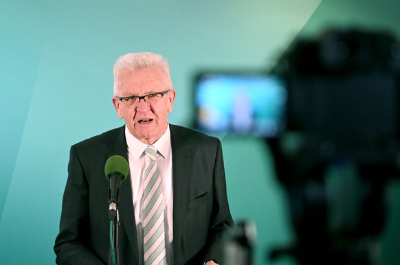 epa09074450 Baden-Wuerttemberg Prime Minister Winfried Kretschmann speaks to media following the Baden-Wuerttemberg state elections in Stuttgart, Germany, 14 March 2021. The state elections in Baden-W ...