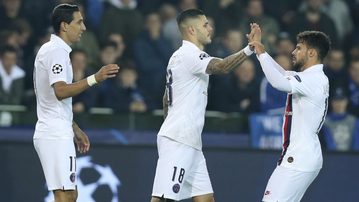 PSG's Mauro Icardi, center, is congratulated after scoring the opening goal of the match during a Champions League Group A soccer match between Club Brugge and Paris Saint Germain at the Jan Brey ...