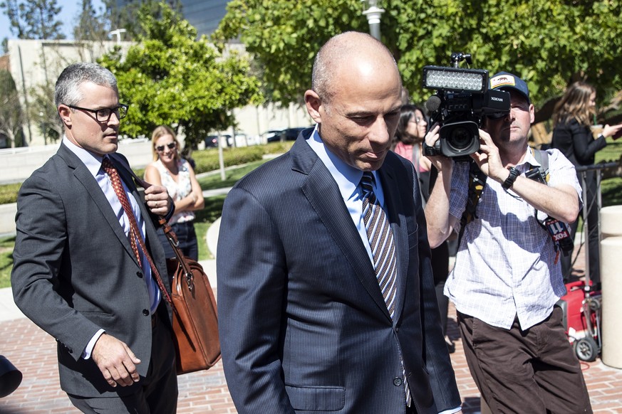 epa07479275 Attorney Michael Avenatti leaves the Santa Ana Federal Court after facing a hearing in Santa Ana, California, USA, 01 April 2019. In California, Avenatti faces charges for alleged bank and ...
