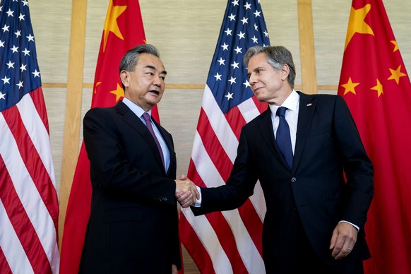 U.S. Secretary of State Antony Blinken, right, shakes hands with China&#039;s Foreign Minister Wang Yi during a meeting in Nusa Dua on the Indonesian resort island of Bali Saturday, July 9, 2022. (Ste ...