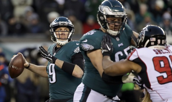 Philadelphia Eagles&#039; Nick Foles in action during the first half of an NFL divisional playoff football game against the Atlanta Falcons, Saturday, Jan. 13, 2018, in Philadelphia. (AP Photo/Matt Ro ...