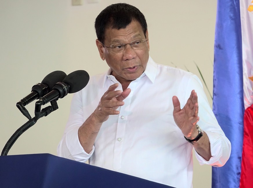 epa05857465 Filipino President Rodrigo Duterte speaks during his departure ceremony before a visit to Myanmar at Davao city international airport, in Davao, Philippines, 19 March 2017. President Duter ...