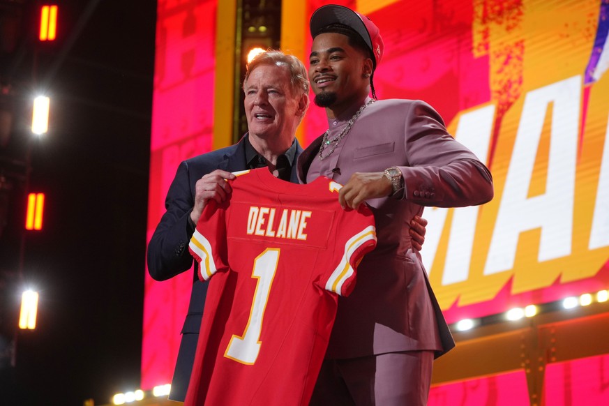 LSU defensive back Mansoor Delane, right, poses with NFL Commissioner Roger Goodell after being chosen by the Kansas City Chiefs with the sixth overall pick during the first round of the NFL football  ...
